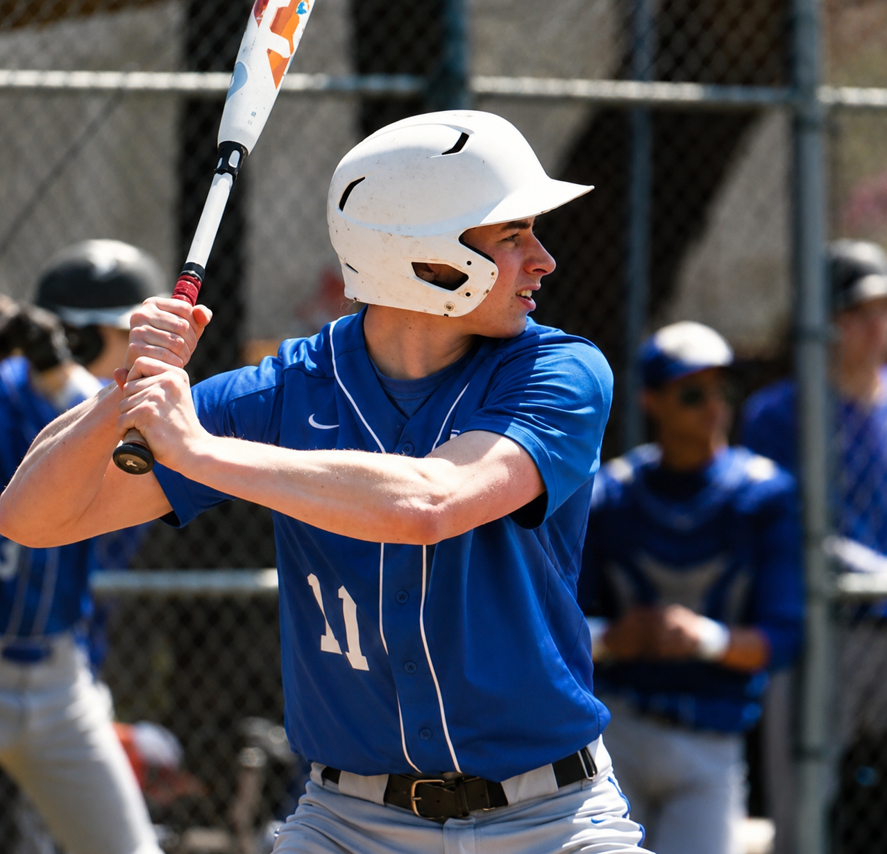 Jack in high school, taking batting practice in the cage with focused intensity