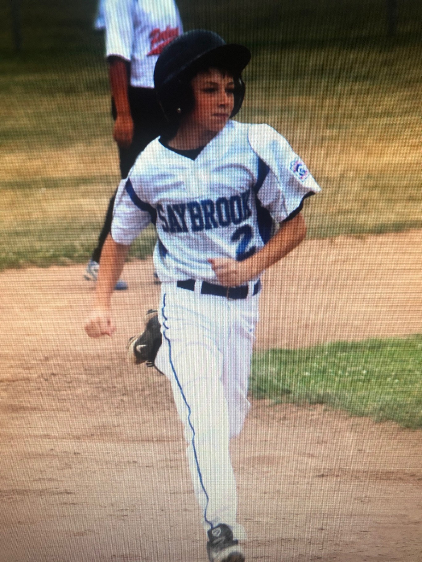 Young Jack in his Saybrook Little League uniform, running the bases with determination